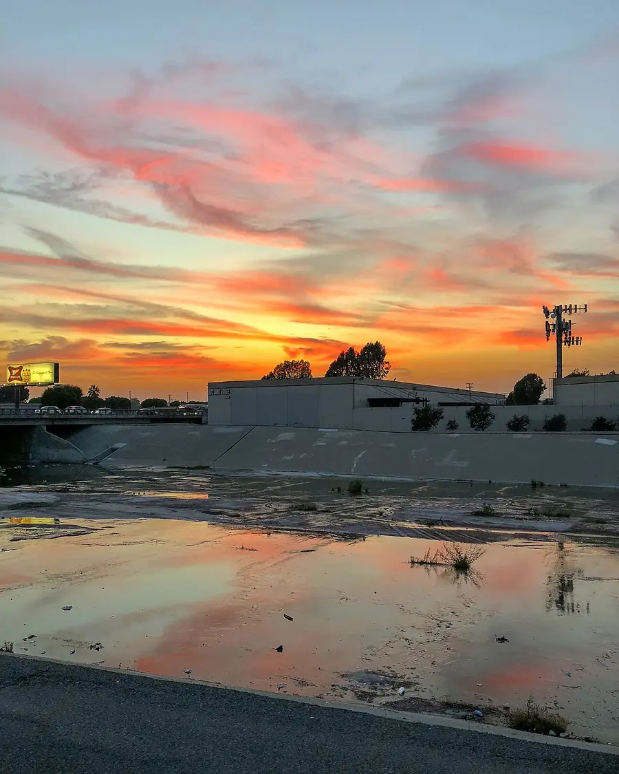 Rio Hondo channel reflecting an orange and pink sunset in El Monte