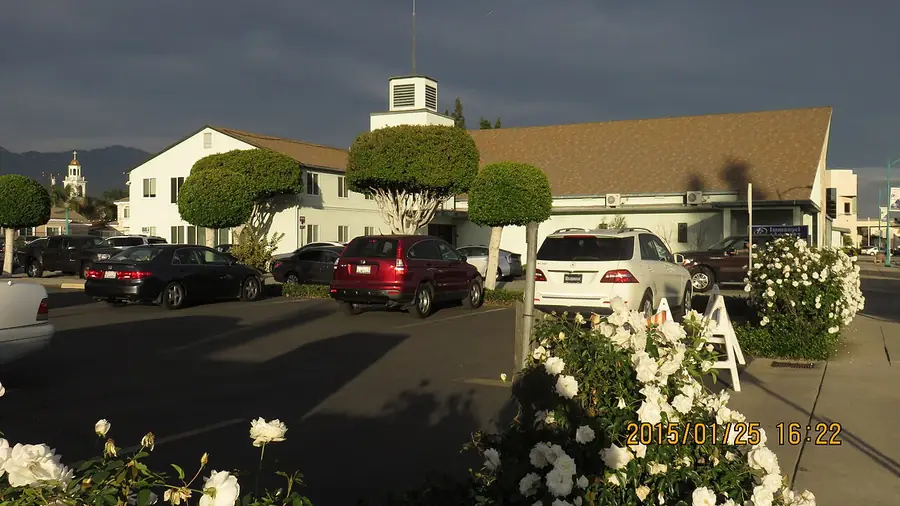 Row of homes and parked cars on a Temple City street at dusk