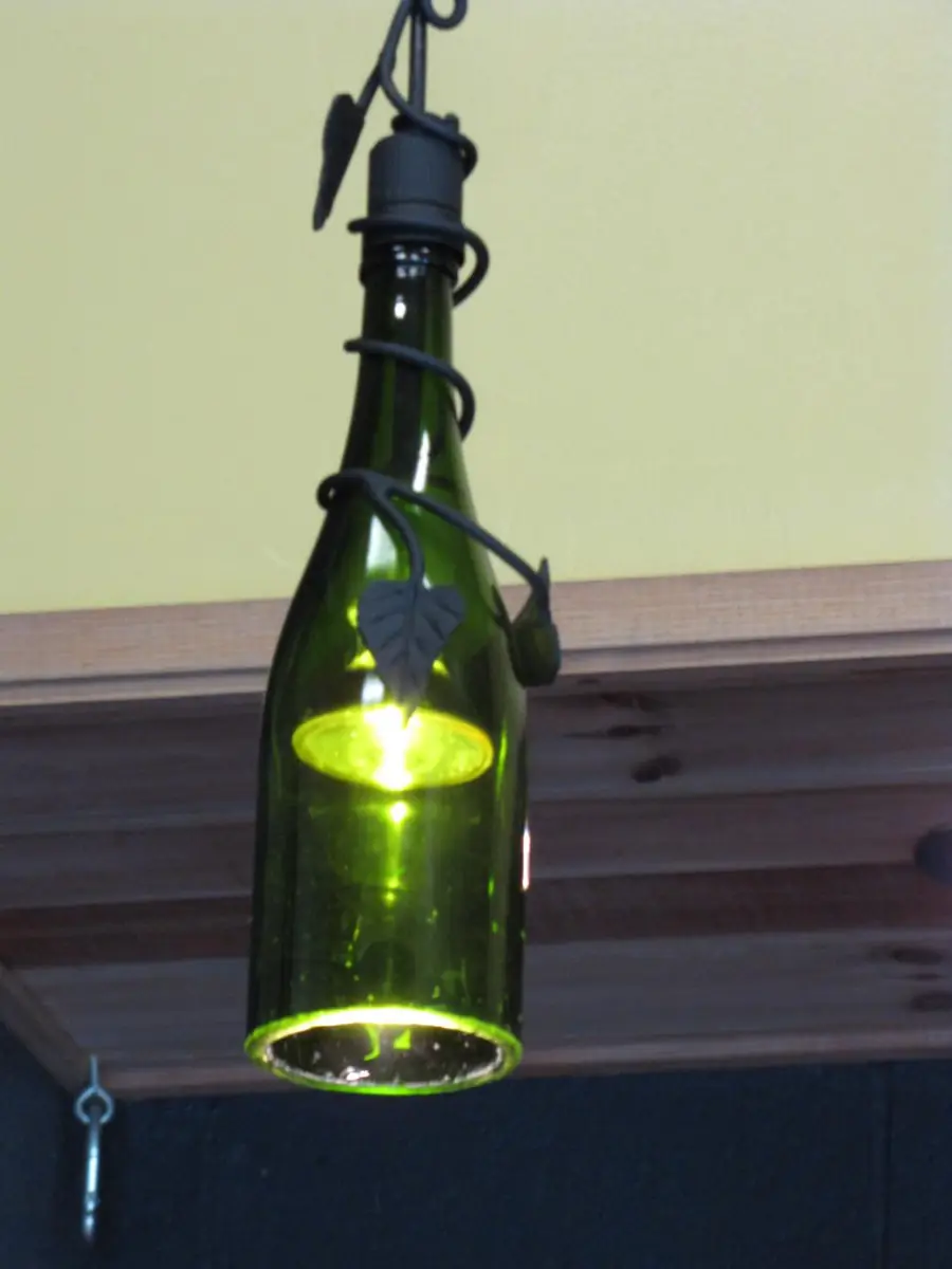 Glass pendant light made from a green bottle shade