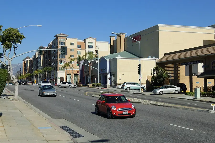 Atlantic Boulevard in Monterey Park with apartments and passing cars