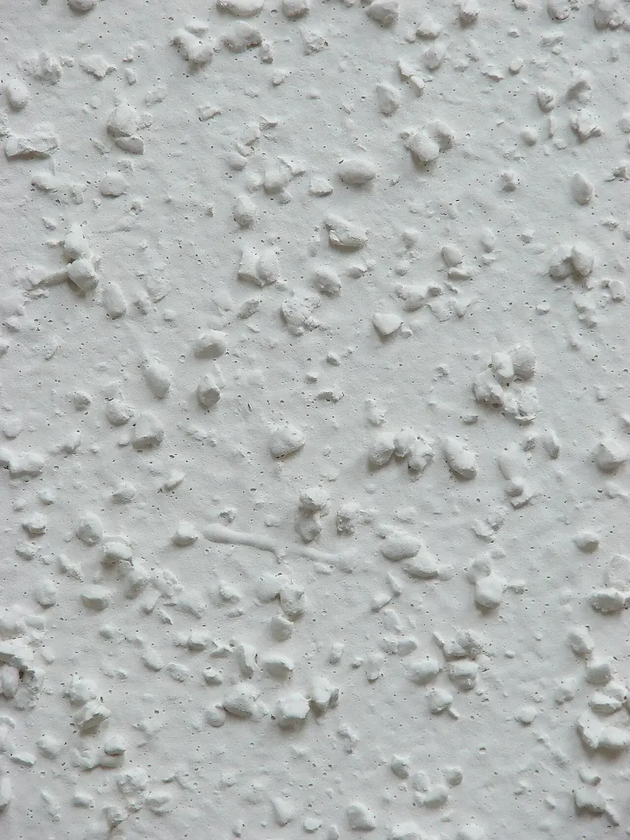 Close view of a bumpy textured drywall ceiling surface