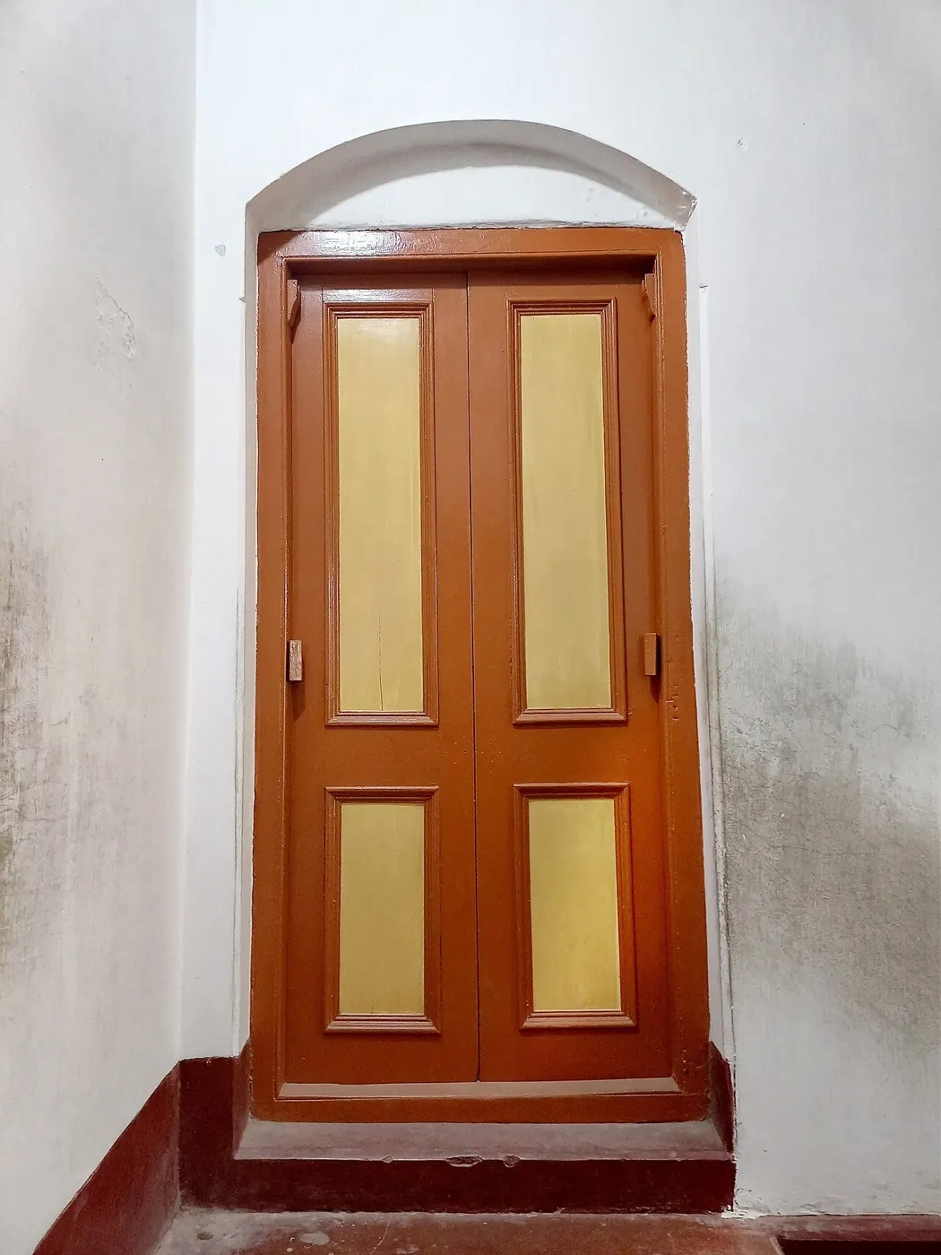 Painted wooden interior door in its frame